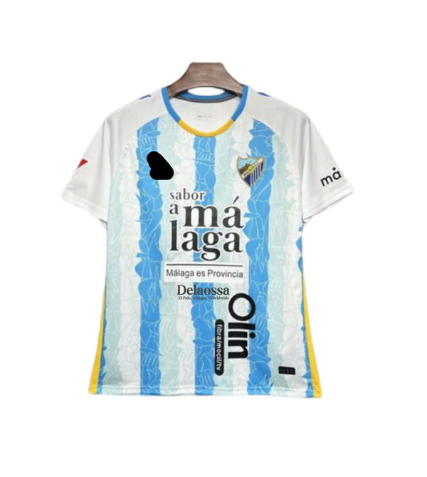 Camiseta Málaga CF x Delaossa – La Madrugá – Celeste y blanca